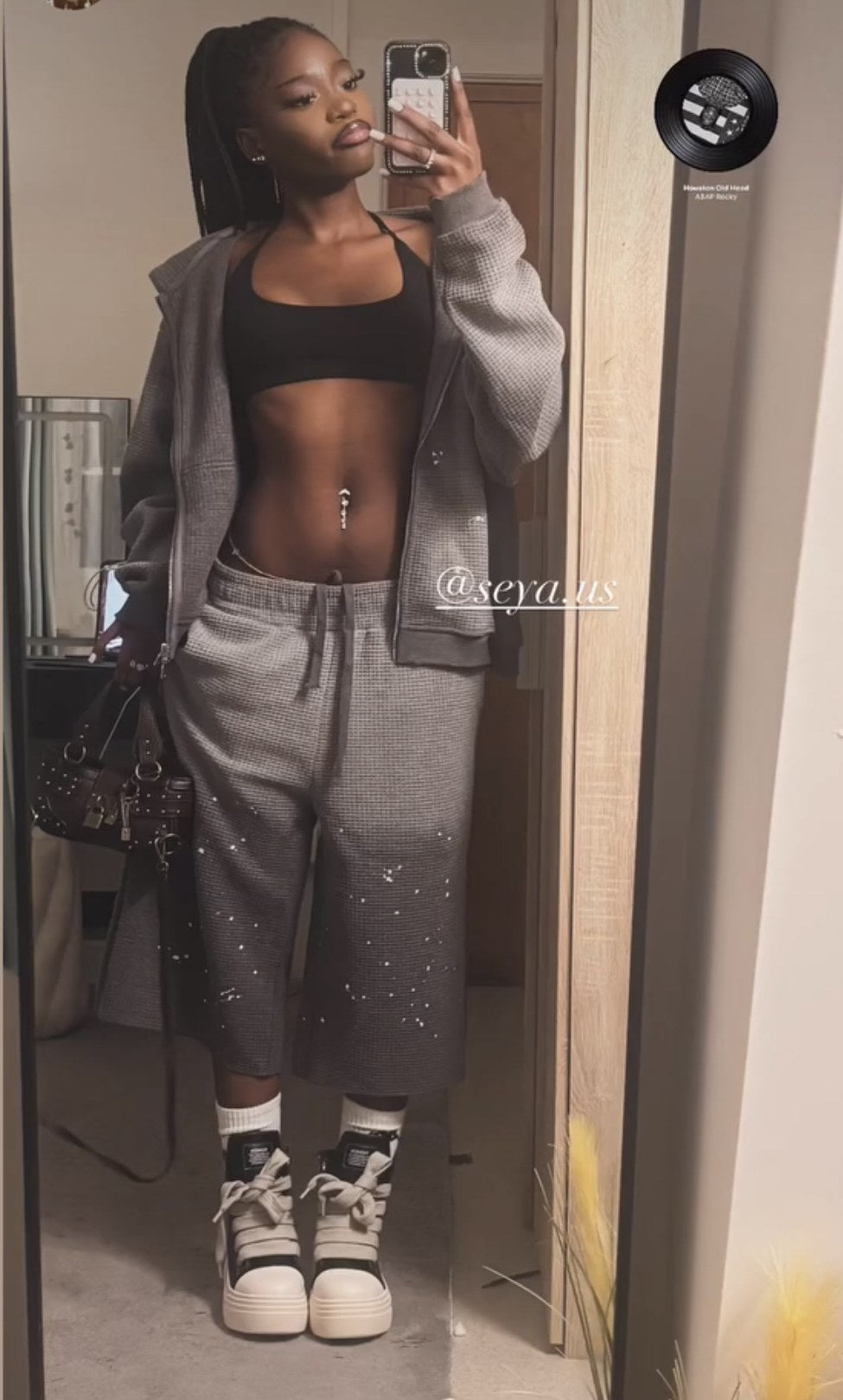 Customer wearing the Daydream hoodie and Wander capri set in ash