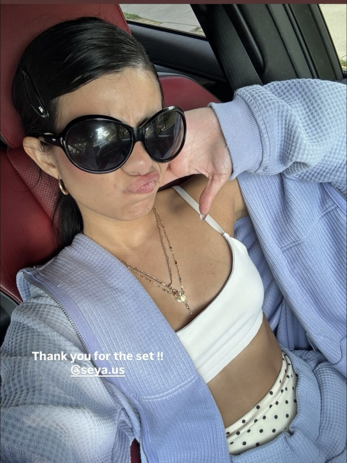 Customer wearing the Daydream hoodie and Wander capri set in sky blue